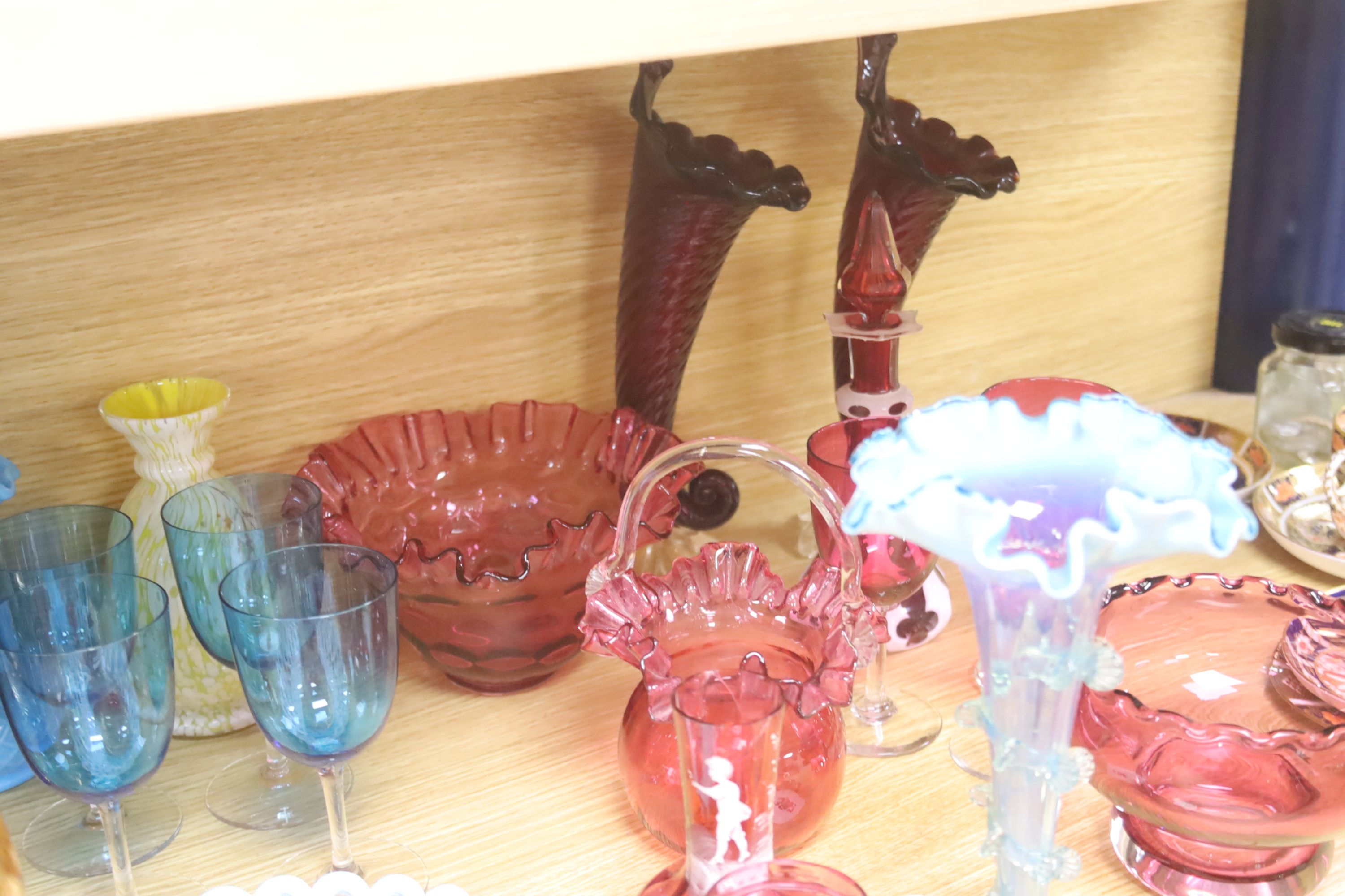 An assortment of 19th century and later coloured glassware including cranberry, Bohemian, Venetian etc.